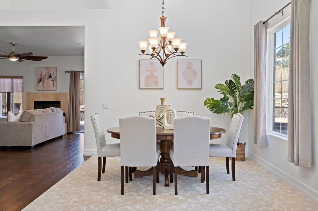 655 Dimaio Way Escondido, CA 92027 - Photo 7 of 46 a view of a dining room with furniture window and wooden floor