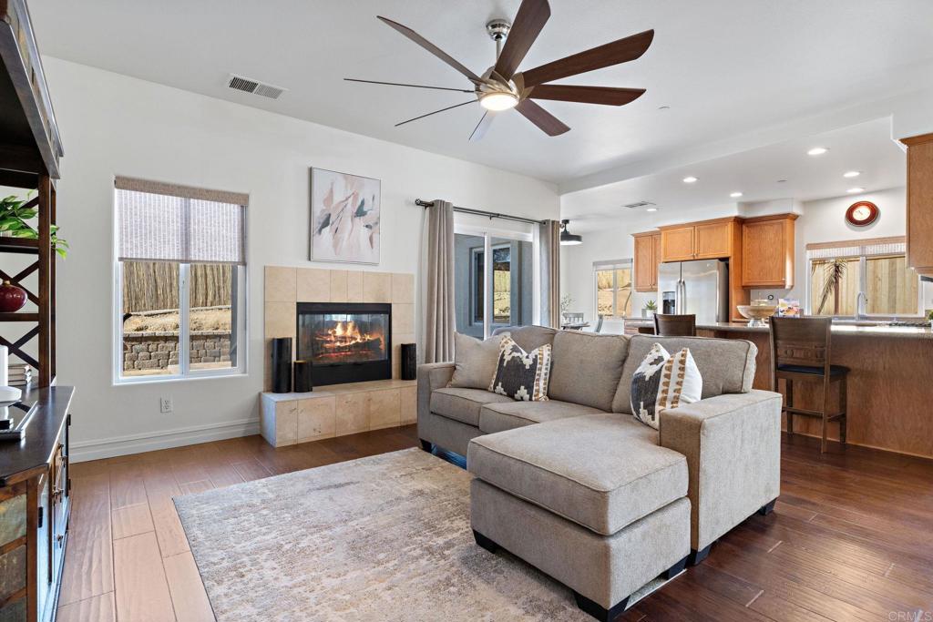 655 Dimaio Way Escondido, CA 92027 - Photo 10 of 46 a living room with furniture and a fireplace