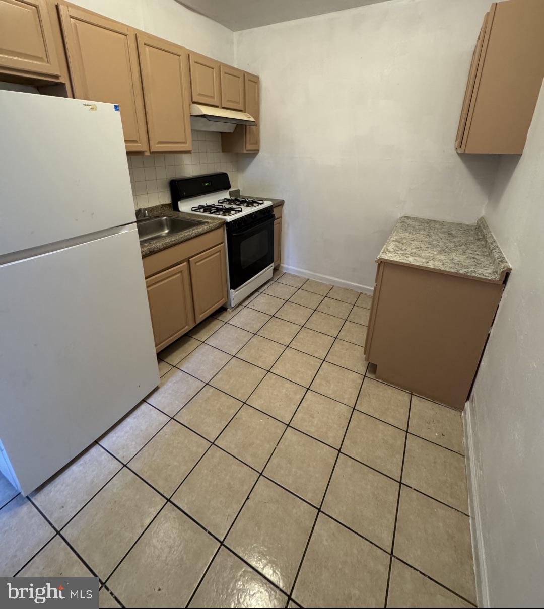 269 East Sharpnack Street Philadelphia, PA 19119 - Photo 3 of 9 Cozy kitchen with modern essentials.