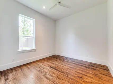 a bedroom with bed and window