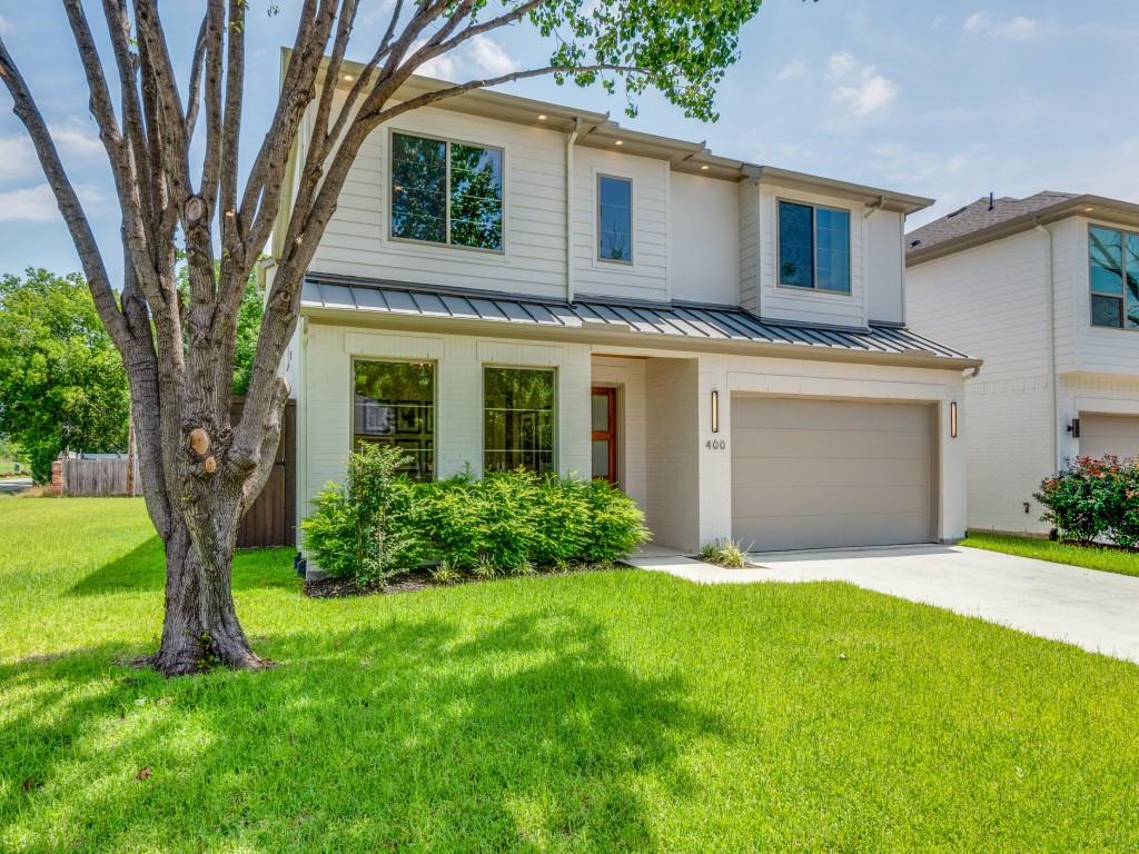 400 Cristler Avenue Dallas, TX 75223 - Photo 3 of 36 a front view of a house with a garden and yard