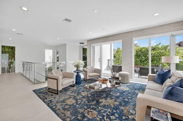 a kitchen that has a lot of cabinets in it and wooden floors