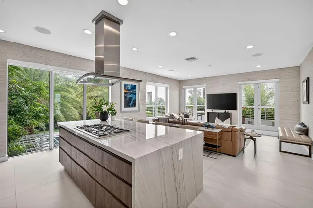 a large bathroom with a granite countertop sink a toilet a mirror and shower