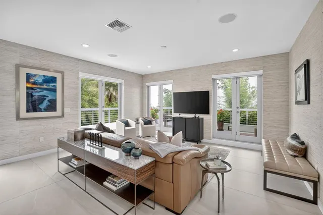 a view of a big room with windows and stairs