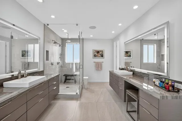 a living room with furniture and a view of kitchen