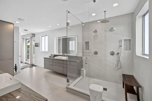 a kitchen with kitchen island a sink table and chairs