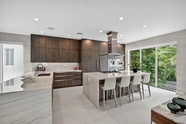 a spacious bedroom with a bed and a couch