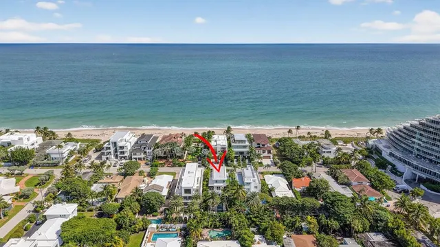 a living room with furniture and stairs