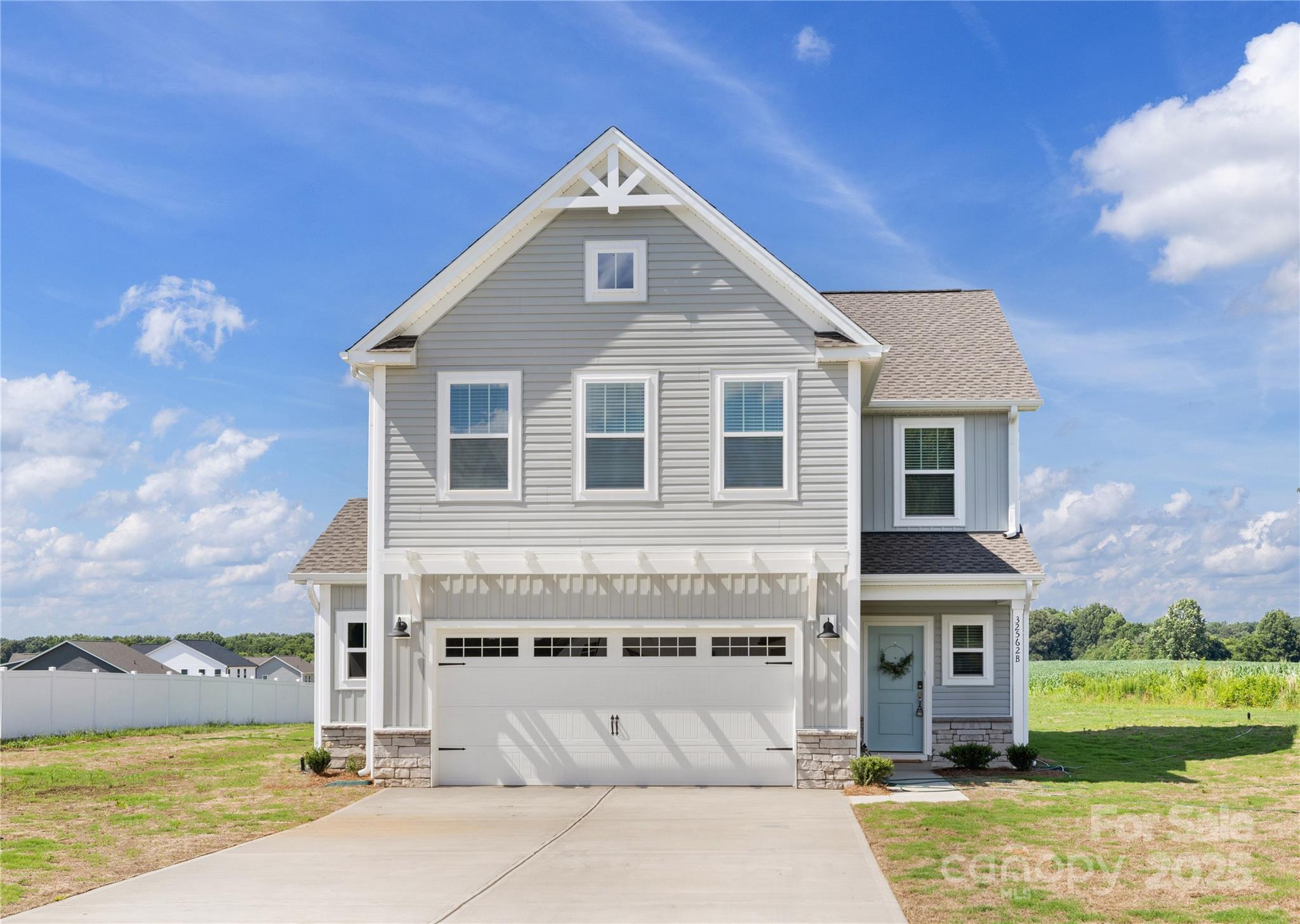32562 B Millingport Road, Unit 7155 New London, NC 28127 - Photo 1 of 28 a front view of a house with a yard