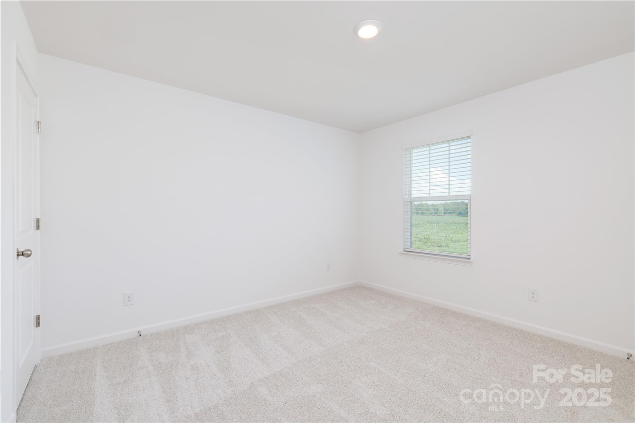 32562 B Millingport Road, Unit 7155 New London, NC 28127 - Photo 21 of 28 an empty room with windows
