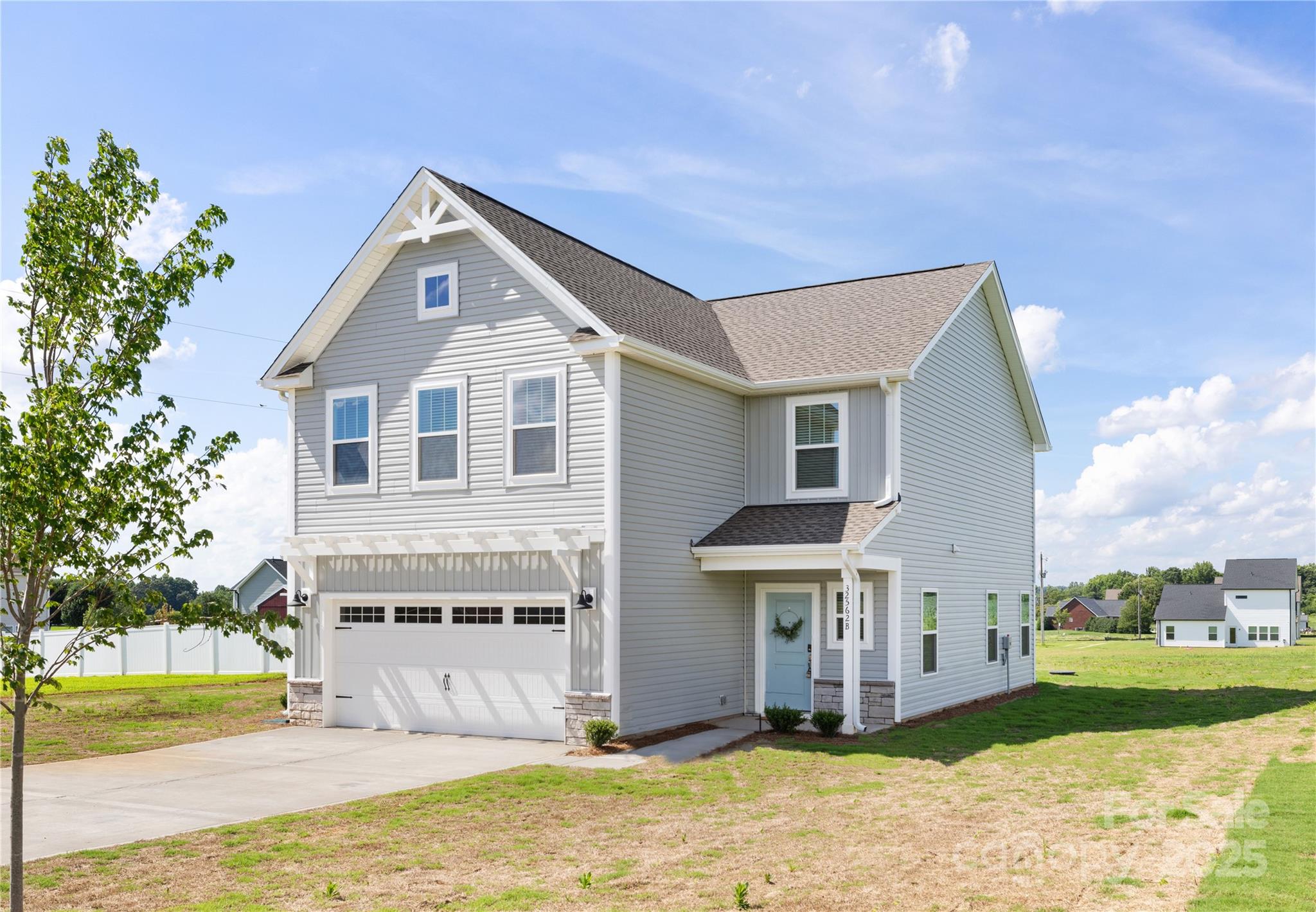 32562 B Millingport Road, Unit 7155 New London, NC 28127 - Photo 3 of 28 a front view of a house with a yard