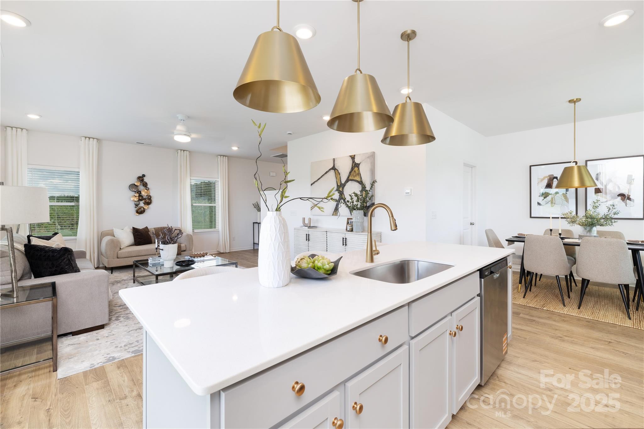 32562 B Millingport Road, Unit 7155 New London, NC 28127 - Photo 6 of 28 a kitchen with sink and living room view