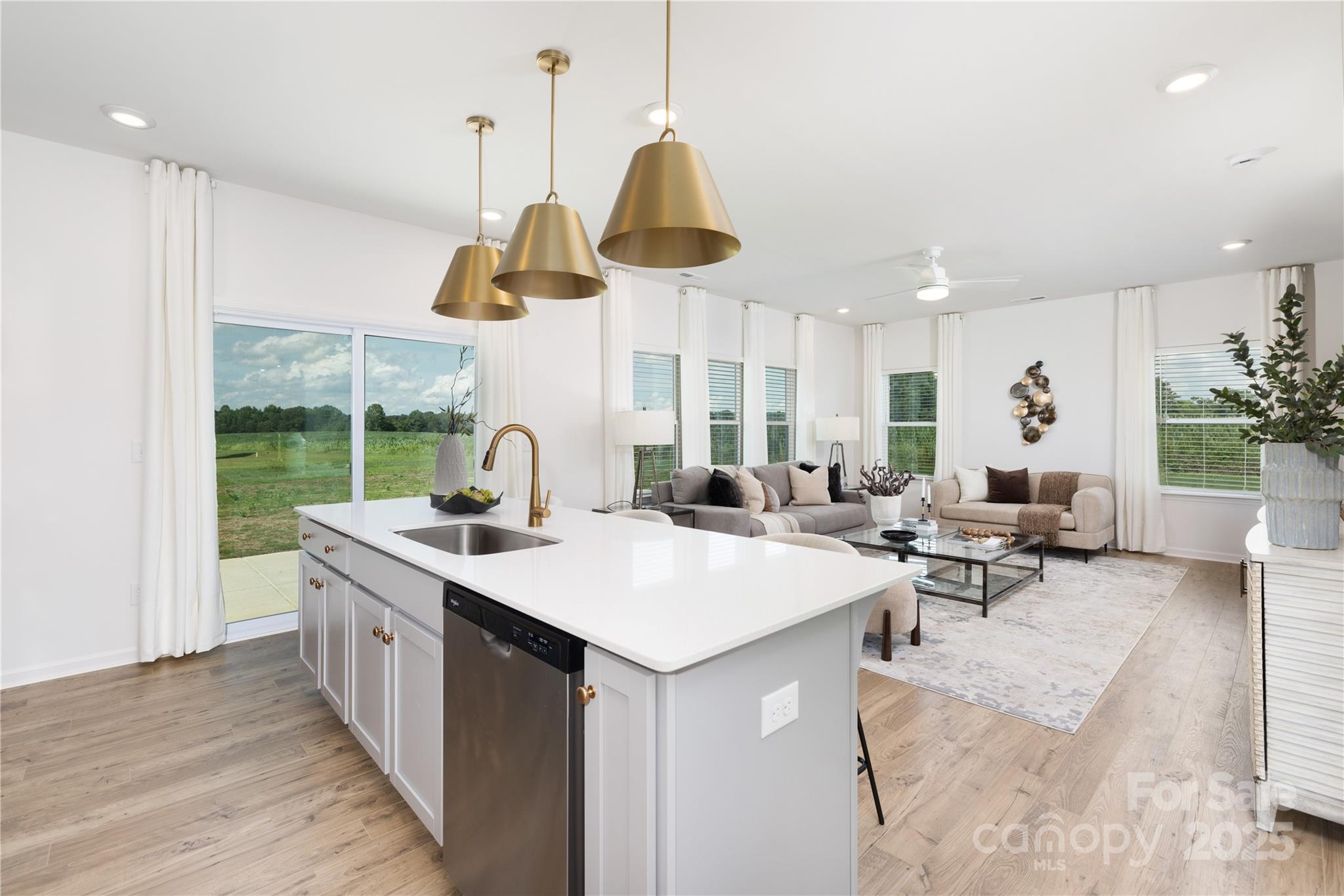 32562 B Millingport Road, Unit 7155 New London, NC 28127 - Photo 7 of 28 a very nice looking room with kitchen island furniture a stove and a window