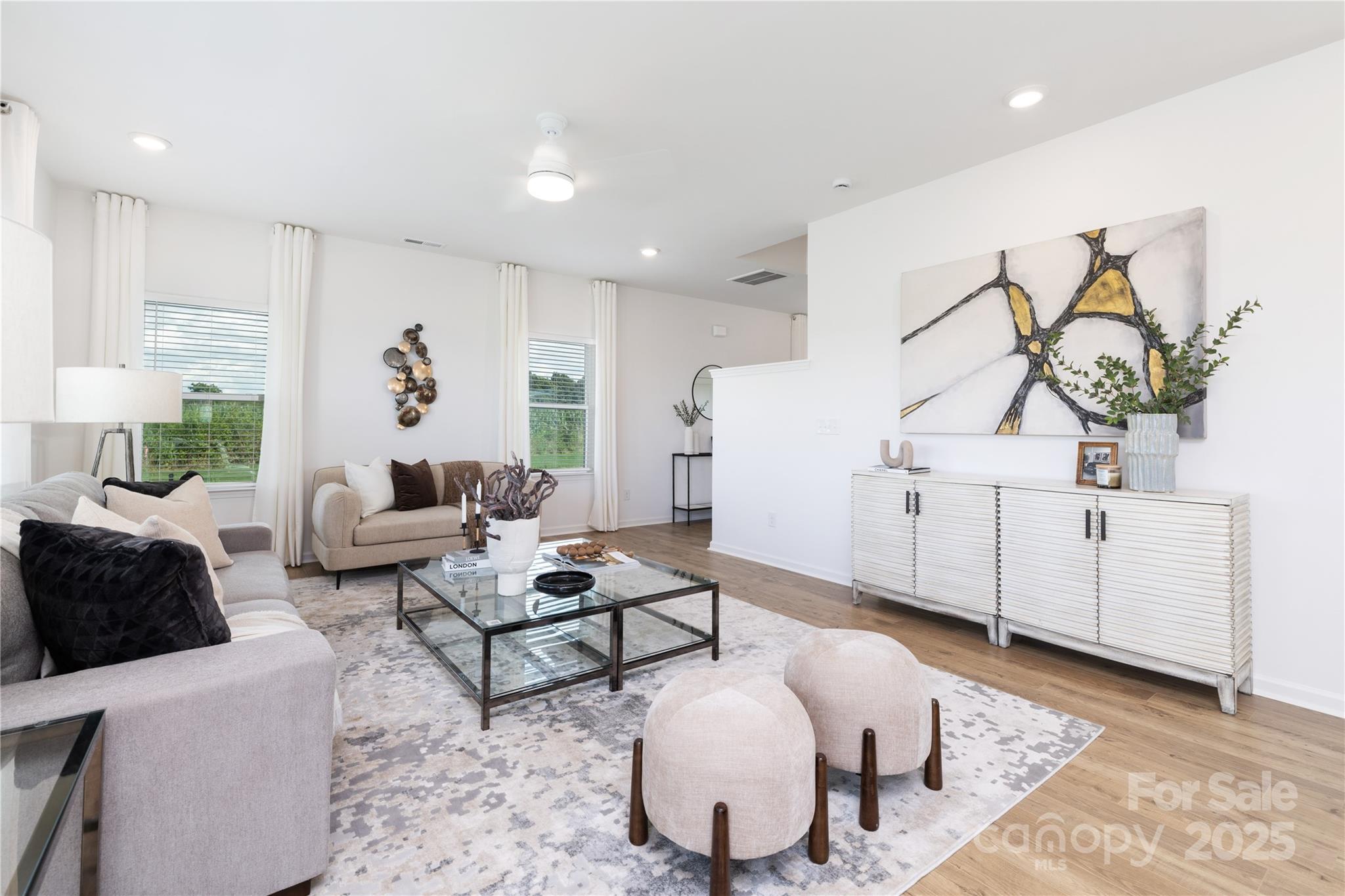 32562 B Millingport Road, Unit 7155 New London, NC 28127 - Photo 10 of 28 a living room with furniture a rug and white walls