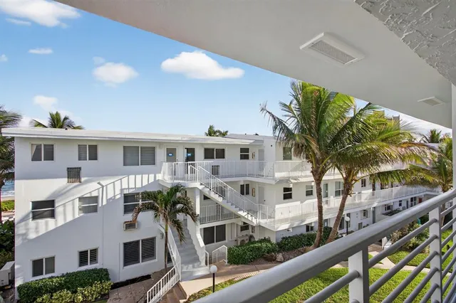 a front view of residential houses with street