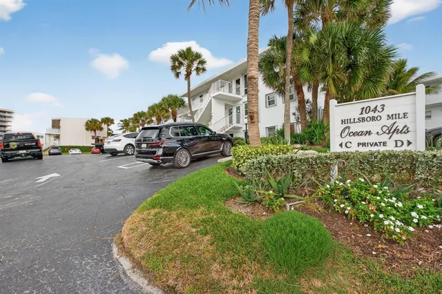 a view of a park that has a sign board