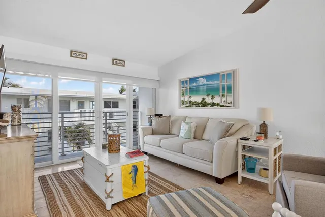 a living room with furniture wooden floor and a fireplace