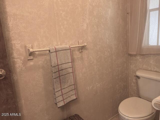 747 East Germann Road, Unit 64 San Tan Valley, AZ 85140 - Photo 13 of 18 a white toilet sitting next to a shower