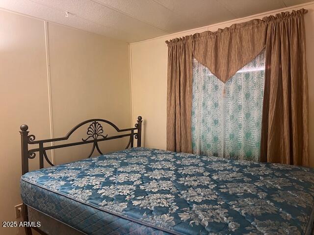 747 East Germann Road, Unit 64 San Tan Valley, AZ 85140 - Photo 4 of 18 a bedroom with a bed a mirror with the background