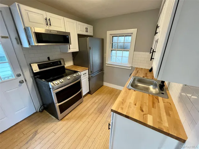 a kitchen with a stove and a microwave