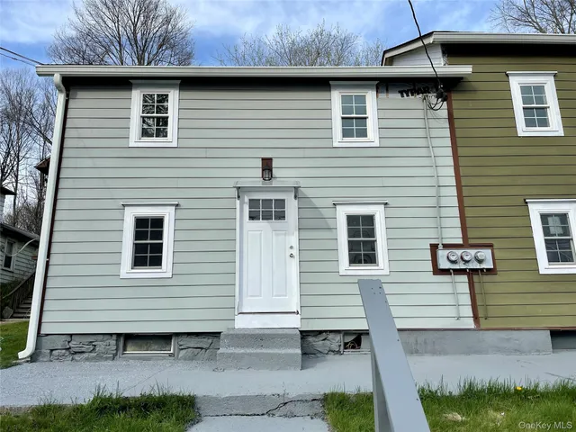 a view of a house with a house and a yard
