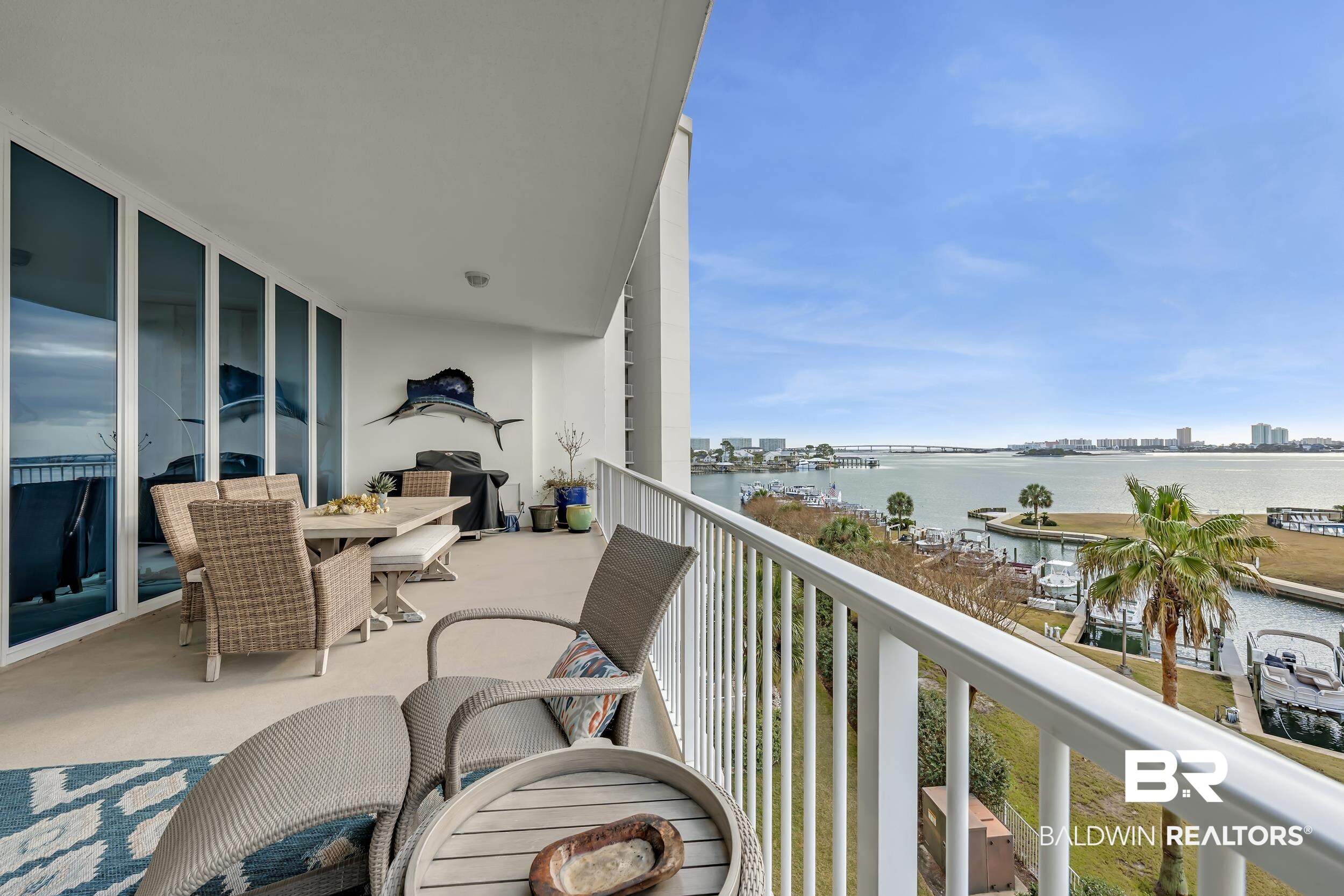 28250 Canal Road, Unit 307 Orange Beach, AL 36561 - Photo 33 of 56 Balcony featuring a water view and outdoor dining area