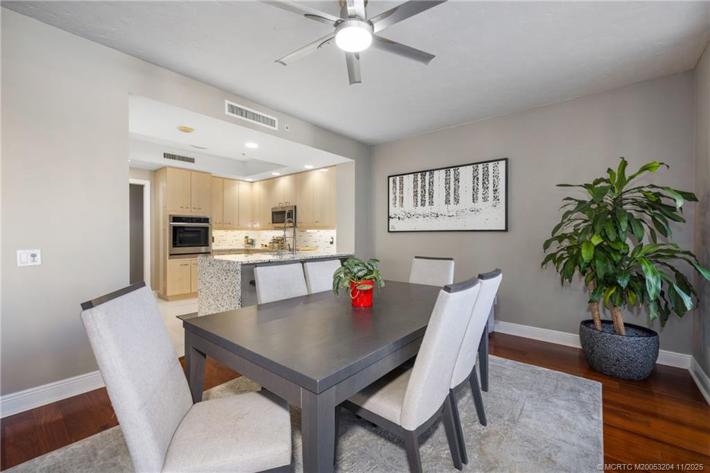 340 Highway 1, Unit 101 Jupiter, FL 33477 - Photo 13 of 42 a view of a dining room with furniture and a potted plant