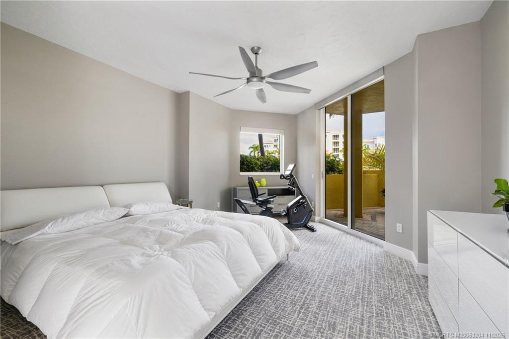 340 Highway 1, Unit 101 Jupiter, FL 33477 - Photo 18 of 42 a large white bed in a room next to a window