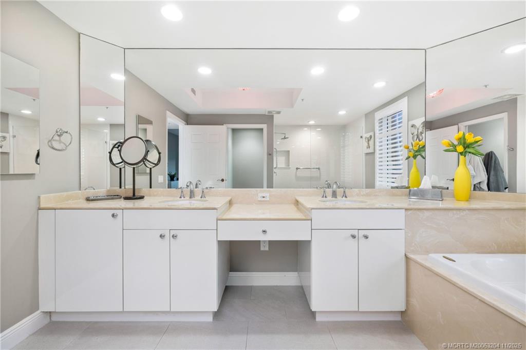 340 Highway 1, Unit 101 Jupiter, FL 33477 - Photo 23 of 42 a large bathroom with a sink and a mirror