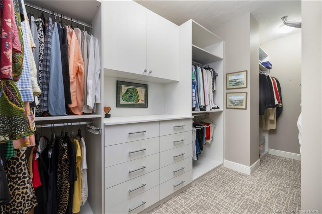 340 Highway 1, Unit 101 Jupiter, FL 33477 - Photo 24 of 42 a view of walk in closet with clothes and shoes