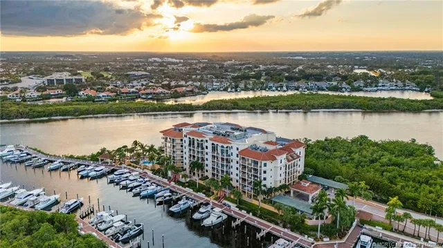 an aerial view of a house with a lake view