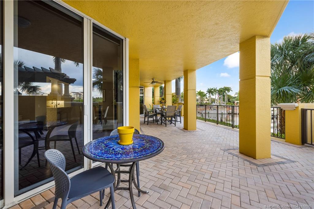 340 Highway 1, Unit 101 Jupiter, FL 33477 - Photo 32 of 42 a view of a chairs and table in th patio