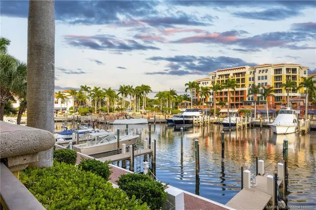 a balcony with chairs and ocean view