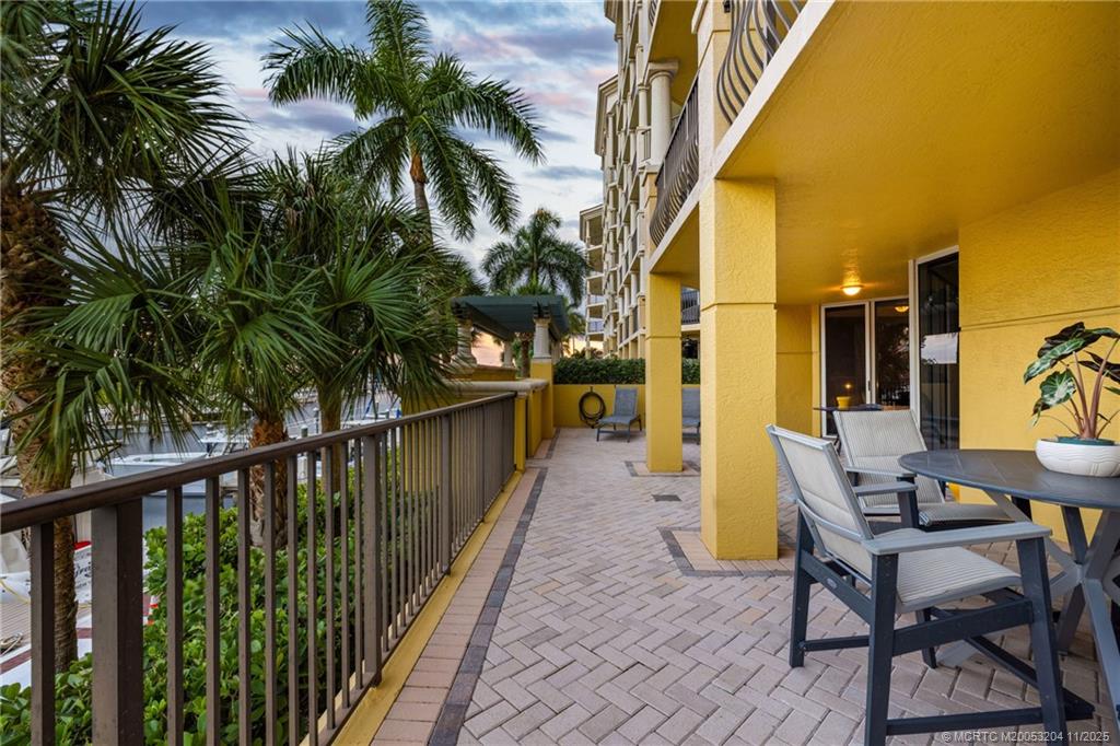 340 Highway 1, Unit 101 Jupiter, FL 33477 - Photo 7 of 42 a balcony with table and chairs
