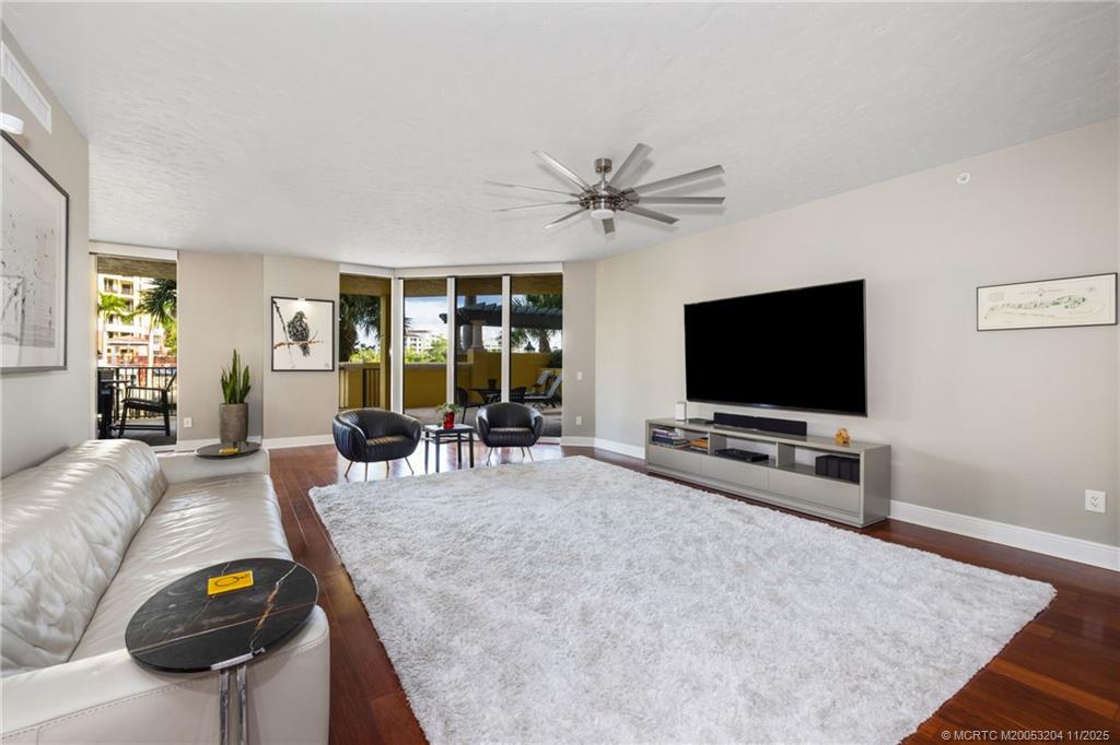 340 Highway 1, Unit 101 Jupiter, FL 33477 - Photo 10 of 42 a living room with furniture and a flat screen tv