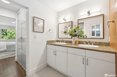 a bathroom with sink and mirror