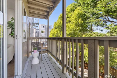 a view of balcony with wooden floor