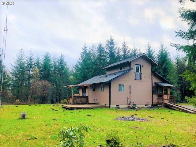 311 Panda Road Washougal, WA 98671 - Photo 1 of 21 a backyard of a house with table and chairs