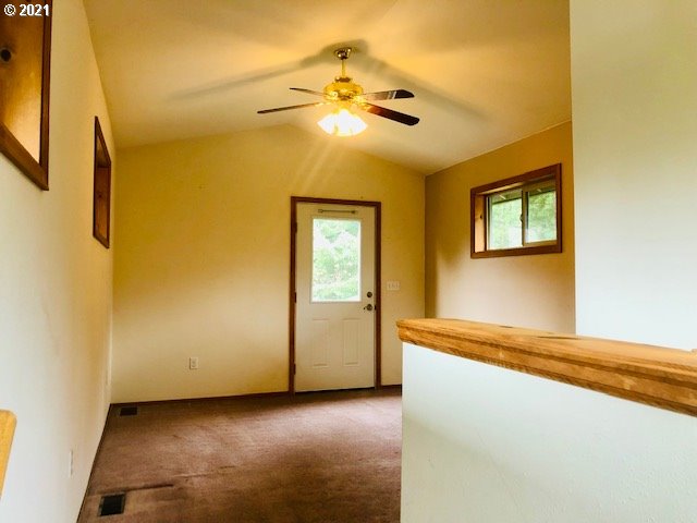311 Panda Road Washougal, WA 98671 - Photo 14 of 21 a view of an empty room with window and chandelier fan