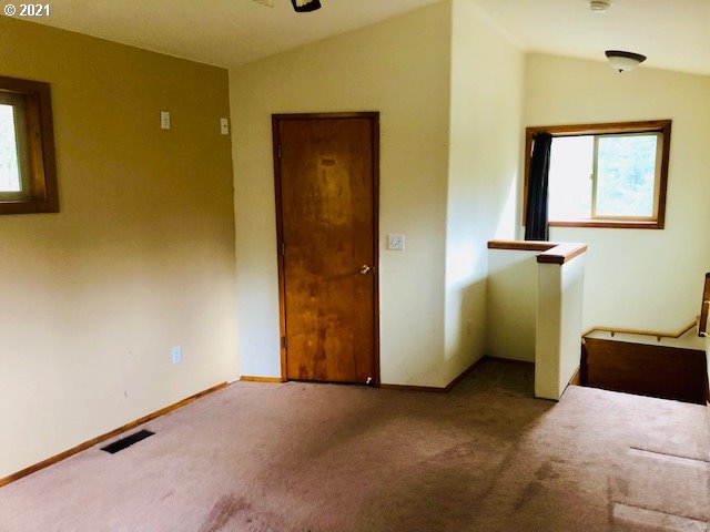 311 Panda Road Washougal, WA 98671 - Photo 15 of 21 a view of a livingroom with wooden floor and windows