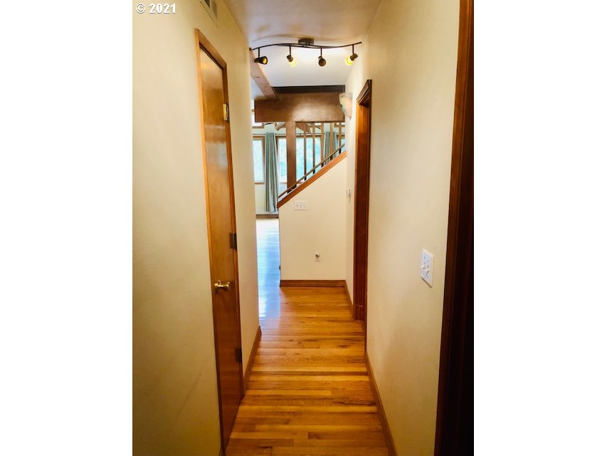 311 Panda Road Washougal, WA 98671 - Photo 16 of 21 a view of a hallway with wooden floor