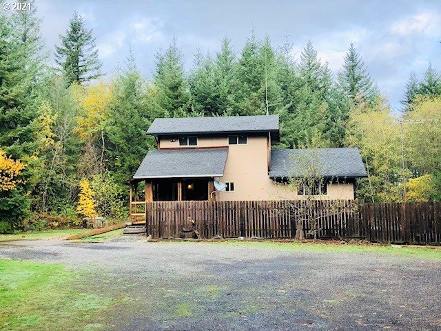 311 Panda Road Washougal, WA 98671 - Photo 4 of 21 a front view of a house with a yard and garage