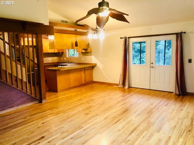 311 Panda Road Washougal, WA 98671 - Photo 9 of 21 a view of a kitchen with a sink and wooden floor