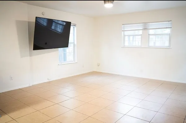 a view of an empty room with a window