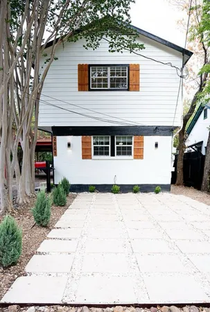 a view of a white house with a outdoor space