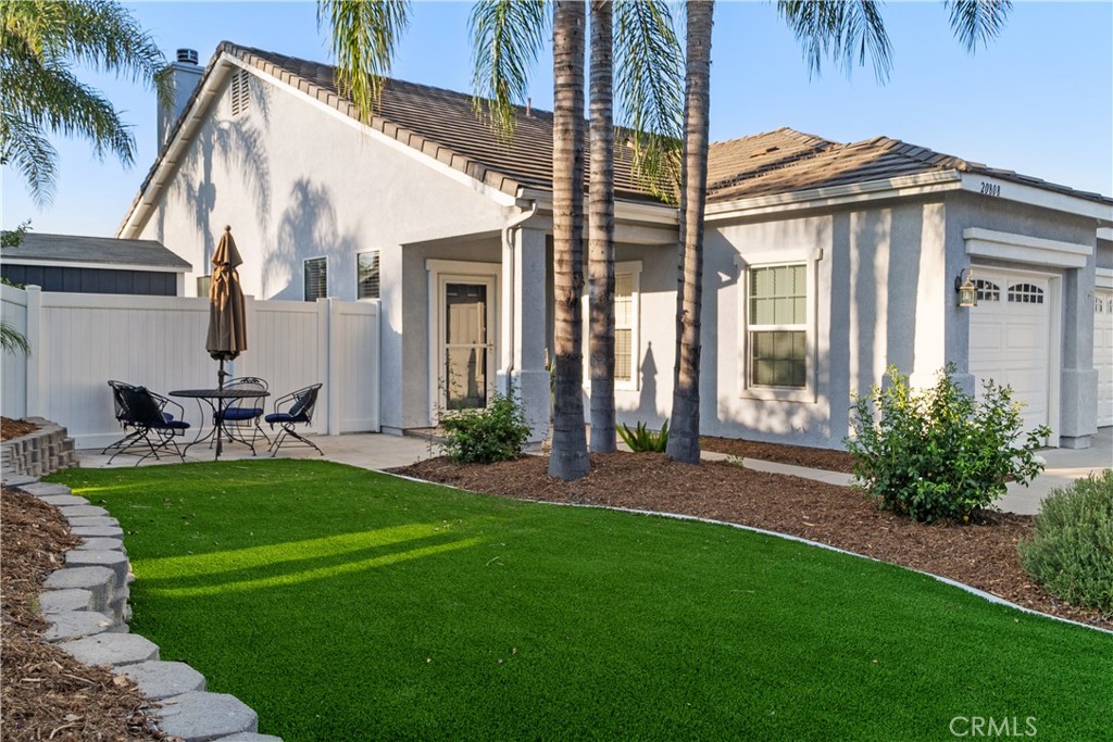 a view of a front of a house with a yard