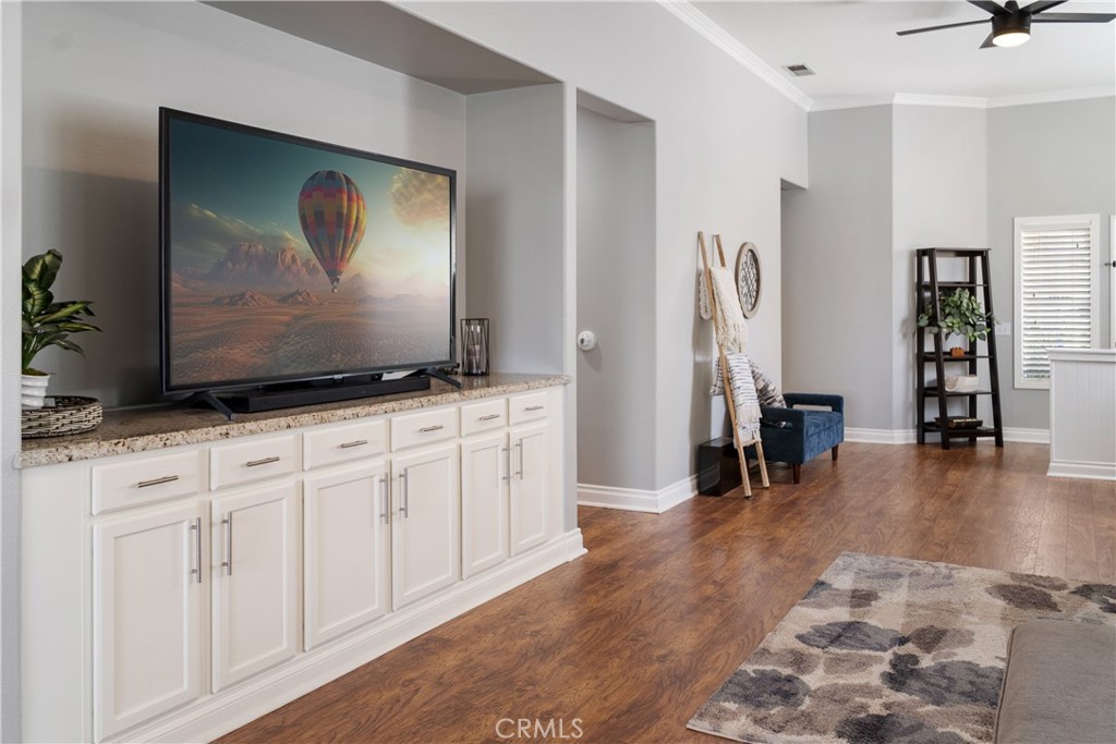 20808 Millbrook Street Riverside, CA 92508 - Photo 16 of 51 a view of a livingroom with furniture and wooden floor