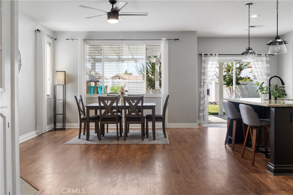 20808 Millbrook Street Riverside, CA 92508 - Photo 18 of 51 a view of a dining room with furniture window and wooden floor