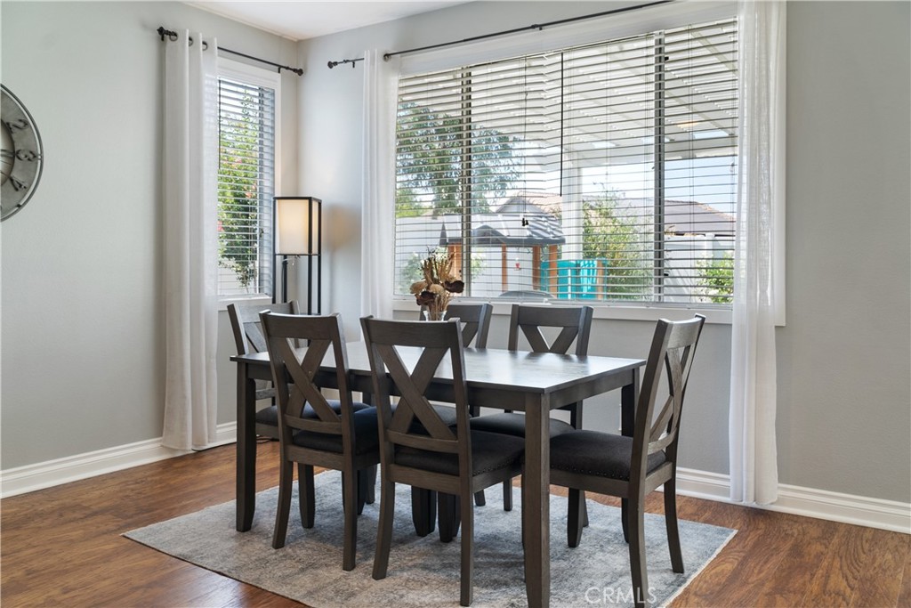 20808 Millbrook Street Riverside, CA 92508 - Photo 19 of 51 a view of a dining room with furniture and wooden floor