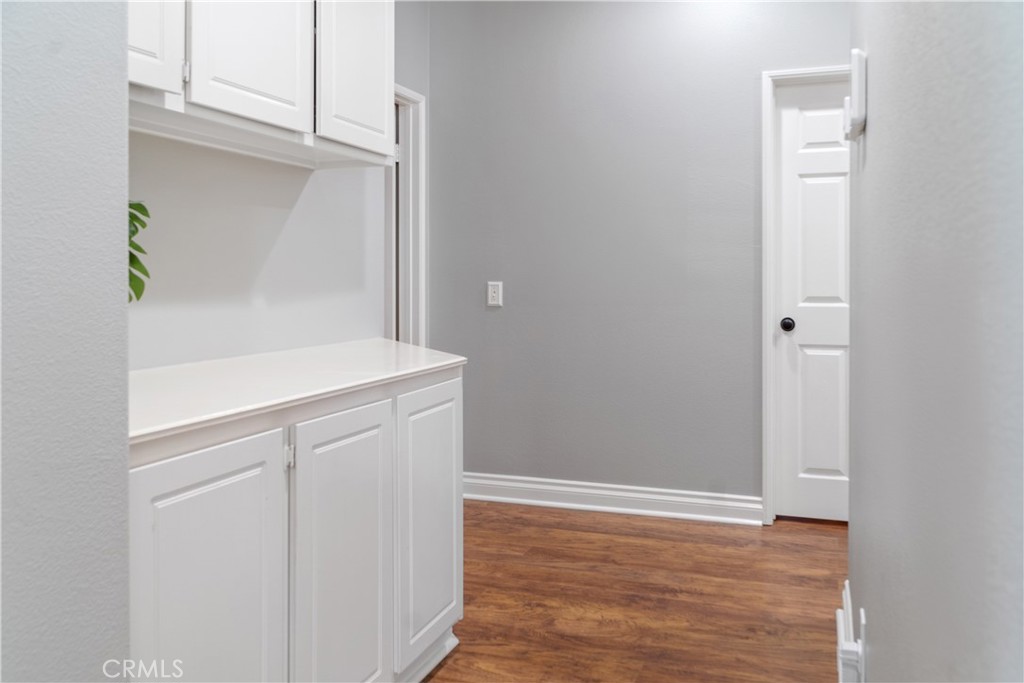 20808 Millbrook Street Riverside, CA 92508 - Photo 26 of 51 a view of storage and utility room with wooden floor